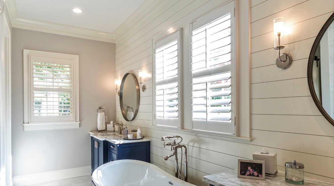 Sacramento bathroom with white plantation shutters.