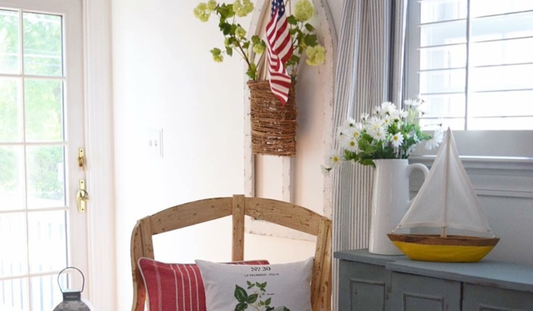 Bright sitting corner with faux wood plantation shutters in Sacramento. Faux wood plantation shutters in Sacramento
