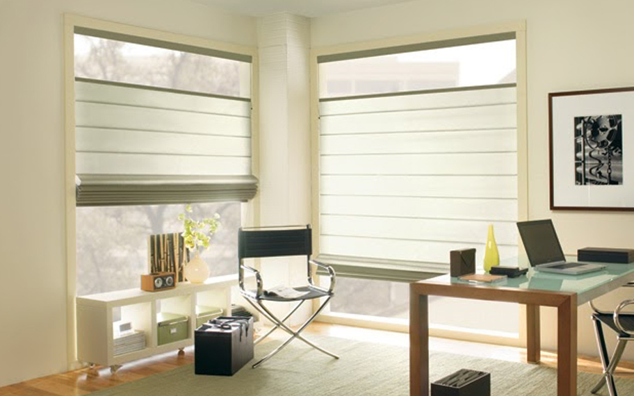 Upgrade your windows with stylish window shades or shutters in Sacramento. Stylish sheer shades in the corner of a modern office.