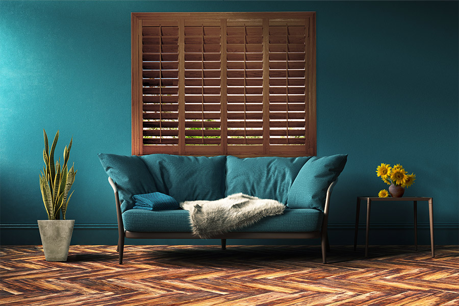 Ovation shutters above a leather couch