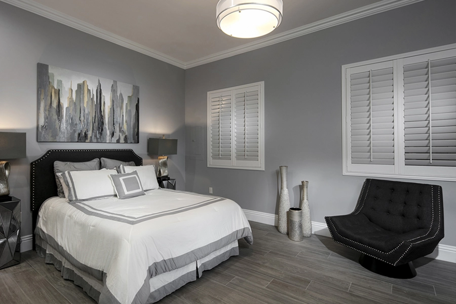Close your custom Polywood shutters to beat the heat and keep your Sacramento bedroom cool. White Polywood shutters on bedroom windows