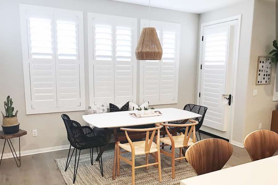 Use Polywood shutters to control natural light levels in your Sacramento dining room. Polywood shutters with top louvers tilted open in a dining room