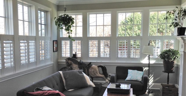 Cafe shutters in a sunroom in Sacramento. Sacramento cafe shutters sun room