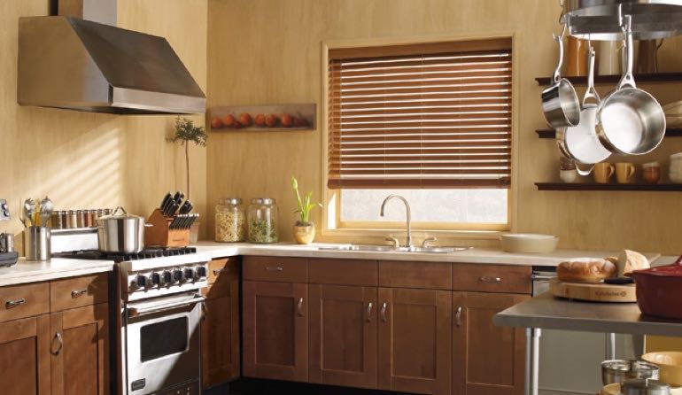 Faux wood blinds look amazing in Sacramento kitchens. Sacramento kitchen faux wood blinds.