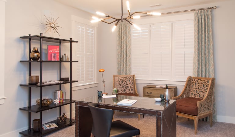 Picking the right window treatments can result in an increase in natural light. Sacramento home office with plantation shutters.
