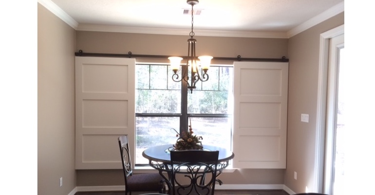 Barn doors open horizontally with slides instead of cords. Sacramento barn door shutters
