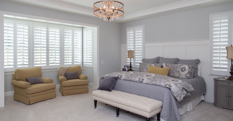 interior shutters offer subtle fashion. Plantation shutters in Sacramento bedroom.