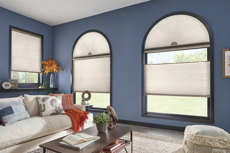If you have a specialty-shaped window, call a window treatment expert to take measurements. arched windows with cellular shades