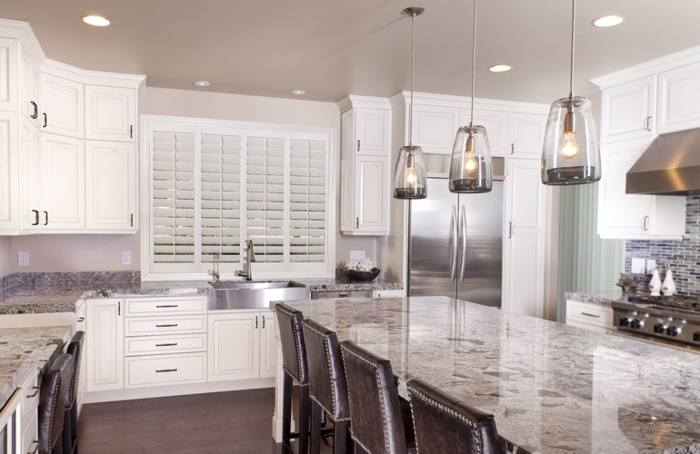 Kitchen Shutters In Sacramento, CA A kitchen window with plantation shutters